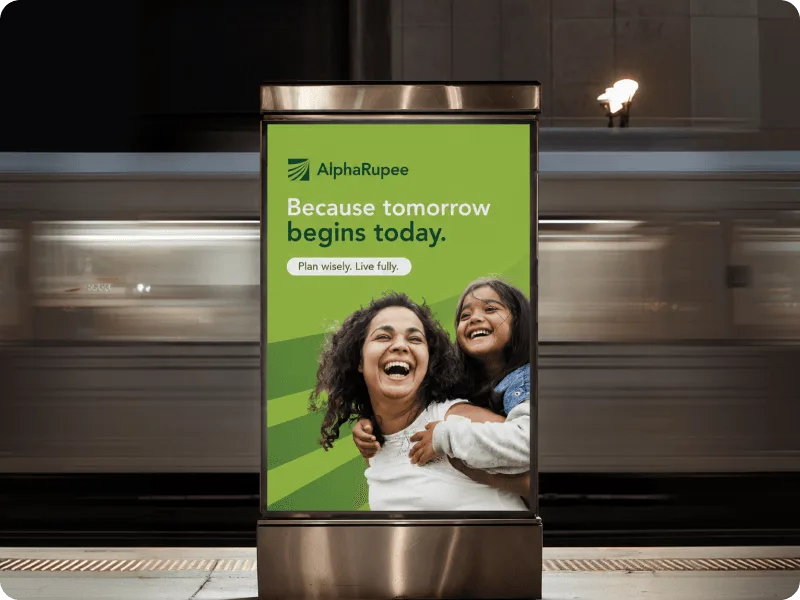AlphaRupee financial planning campaign displayed on a metro station advertising panel