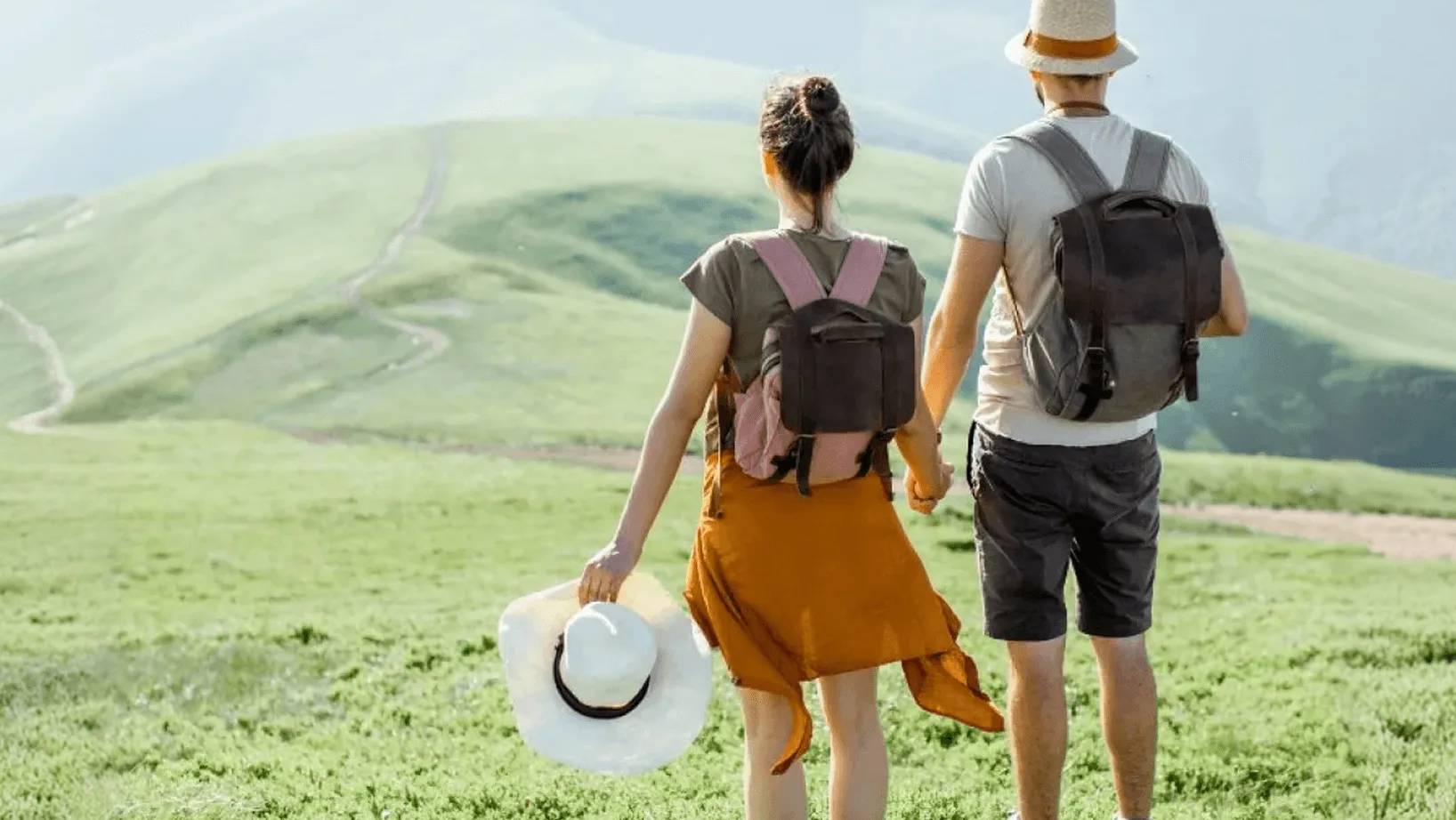 Travellers with backpacks exploring a scenic mountain destination